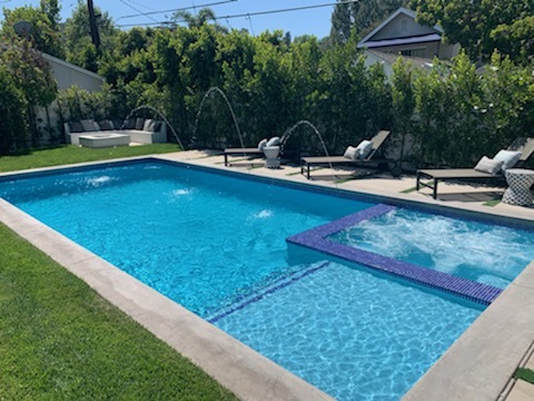 Pool with water sprayers.