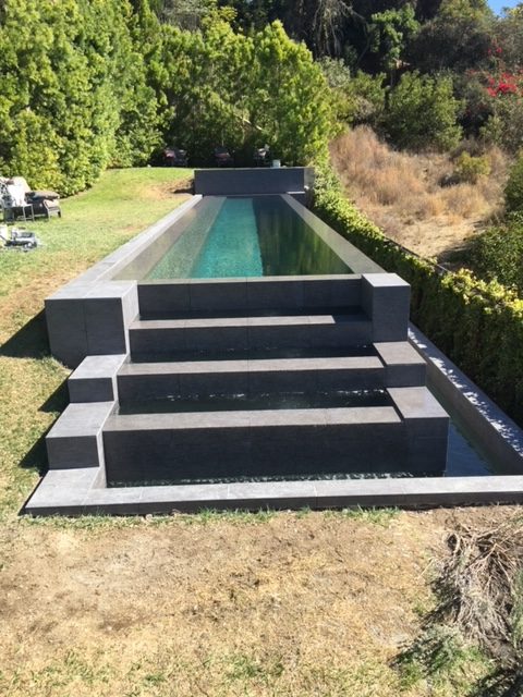 Pool with small staircase of smaller pools.